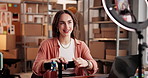 Ring light, live streaming and woman with jewelry, startup and video with smartphone on social media. Entrepreneur, digital marketing or person with bracelets in warehouse, mobile and brand awareness