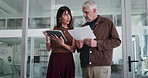 Business people, tablet or documents in office for conversation, timesheet verification or HR admin. Mature man, woman and discussion in meeting with tech, paperwork and review for management report.