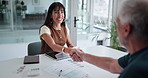 Business woman, shaking hands and documents in meeting with deal, welcome and financial results. Mature person, handshake and smile with graphs, paperwork or advice with charts at investment agency