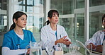 Doctors, nurses and training in hospital together for collaboration, internship review or meeting. Conversation, feedback and medical with healthcare team in clinic for education or mentorship