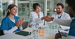 Meeting, doctors and clapping with handshake in clinic for hiring success, new recruit or welcome. Healthcare staff, people and celebration for hospital onboarding, medical promotion and achievement