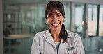 Face, woman and doctor with arms crossed for healthcare, confidence and wellness career in lobby. Smile, physician or medical professional with portrait for about us, management and support in clinic