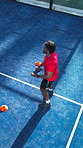 Padel racket, outdoor and athlete with ball on court, sport practice or summer training for skills development. Above, fitness and man swing tennis gear for coordination, energy or cardio for warm up