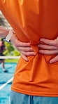 Hands, back pain and person with injury at padel court, joint inflammation or training accident. Sports, health and tennis player with sore spine, massage or athlete with muscle tension outdoor