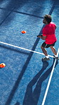 Padel racket, outdoor and man with ball on court, sport practice or summer training for skills development. Above, fitness and athlete swing tennis gear for coordination, energy or cardio for warm up
