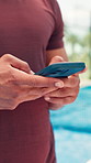 Hands, padel and phone with man for fitness, text message or social media post on court. Digital app, typing and sports with athlete at outdoor tennis for communication, exercise or mobile update