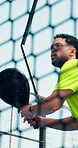 Fitness, low angle and man at net with victory, celebration or swing in competition action. Padel, sports match or athlete outdoor with barrier, win or game endurance in training performance.