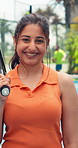 Face, athlete and woman with smile for padel with fitness pride, match practice and training. Portrait, person and racket on tennis court, sports confidence and competition game of outdoor tournament