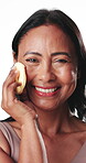 Face, happy woman or sponge in studio for skincare, makeup removal or facial cleansing routine. Mature person, smile or cosmetic tools for cleaning skin, grooming and exfoliation on white background.