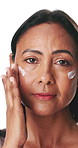 Mature woman, face cream and skincare in studio for beauty, application and glow on white background. Person, lotion and moisturizer product in portrait with hydration, grooming or benefits in Mexico