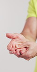 Injury, pain and hands of man in studio for workout accident, fitness and training exercise. Sports, person and athlete massage palm for sprain, inflammation and muscle ache on white background