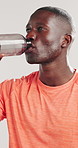 Black man, fitness and drinking with water for hydration or break on a white studio background. Active, male person or African model with thirst, mineral liquid or aqua beverage for rest or recovery