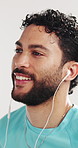Fitness, athlete and man with earphones, studio and listening to music with subscription for workout. White background, streaming and person with tech for entertainment, dancing and audio on break