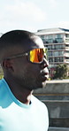 Workout, running and black man in city on bridge for fitness, training or health in morning. Wellness, highway and African male athlete with cardio exercise for sports practice in urban town.