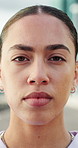 Face, serious and woman in city for fitness, exercise and wellness with confident athlete. Portrait, runner and person outdoor with determination for cardio challenge, workout and health in Spain