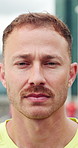 Face, serious and athlete man in city for fitness, cardio exercise and marathon practice. Confident, male person and closeup for sports training, workout challenge and morning routine for wellness