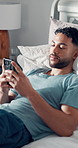 Home, smartphone and man in bedroom, thinking and relax with social media, morning and app. Apartment, cellphone or person with connection, decision or typing with communication, thoughtful or wonder