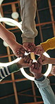 Below, school kids or fist bump with teamwork for academic growth, skill development or learning success. Children, huddle and hands together for collaboration, study achievement or group solidarity.