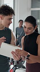 Gym, membership and people with clipboard, talking and explaining info for fitness class or session. Happy, woman and listening to man with checklist for registration, personal trainer and sign up