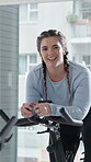 Spin class, bike and woman with smile, exercise and physical activity for fitness, health and cardio. Happy, person and workout routine with machine, mobility and equipment for body strength in gym