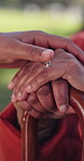 Park, hands and person with disability for senior care, support and comfort in nature. Elderly woman, cane and caregiver in garden for empathy, trust and rehabilitation in retirement or nursing home