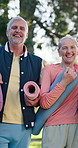 Nature, fitness and face of senior people at yoga class for health, wellness or exercise together. Happy, mats and portrait of elderly friends in retirement outdoor in park for workout in morning.