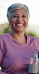 Elderly, happy woman and face with water for fitness, health or outdoor wellness in nature. Portrait, senior or active female person with smile for pilates, physical activity or exercise in park