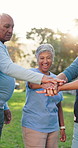 Senior people, volunteer and stack hands at park, excited and celebration with social responsibility. Women, men and motivation with circle, support and team for goals with success at charity event