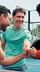 Tennis, team and men with fist bump on court for match training, healthy competition or game start. Padel, happy players and greeting at sports club for friendly tournament, contest and sportsmanship