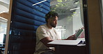 Man, research and tablet in office pod for creative project, editor feedback or article review. Hybrid work, journalist and thinking in cubicle for proofreading, publishing schedule or blog planning