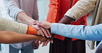 Business people, meeting and huddle with hands together for unity, trust or diversity in office. Closeup, group or team with circle, pile or stack for solidarity, mission or inclusion in workplace