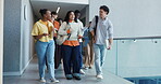 Walking, students and talking in hallway, college and planning for exam with friends and scholarship. University, education and people with academic grant for course, discussion or preparing for test