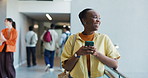 University, laugh and woman with phone for social media, networking and online message on campus. College, academy and happy student on smartphone for website, internet and connection in hallway
