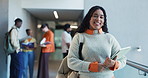 Happy, college and face of woman in hallway ready for learning, education and knowledge. University, school and portrait of student with books, confidence and studying for scholarship on campus