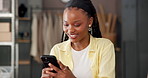 Phone, small business and black woman in office for shipping, fashion supply chain or online review. Logistics, mobile and happy worker with distribution update, typing or reading email for ecommerce