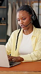 Black woman, consultant and headset with laptop for fashion business startup or customer service. Female person, agent or communication on computer in clothing boutique for online order or logistics
