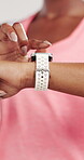 Woman, hands or smart watch in studio for exercise, tracking heart rate or fitness progress app. Person, scroll or check time for workout results, wellness or monitor step counter on white background