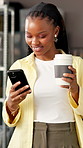 Woman, typing or coffee in office with phone for viral fashion trend, social media post or startup. Black person, hot drink or scroll in ecommerce business with tech, popular clothing or online idea.