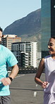 Running, fitness and people in city, conversation and training with challenge, endurance and fist bump. Happy, runners and athlete in street, competitive and exercise with practice, cardio or support