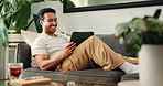 Tablet, video call and man on sofa in home for communication, networking or connectivity. Happy, digital technology and male person on virtual conversation for contact in living room at apartment.