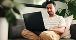 Break, laptop and typing with man on sofa in living room of home for college or university assignment. Computer, relax and report with person in apartment for education, learning or online study