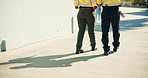 Back, legs and people with warehouse, walking and inspection with teamwork for storage. Technician, outdoor and quality assurance for supply chain, logistics and collaboration for production depot