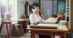 Laptop, laughing and phone call with woman in logistics office for delivery or shipping update. Communication, conversation and funny with mature employee in supply chain workplace for distribution