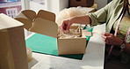 Packing, delivery and hands of woman in office with box for ecommerce order with small business card. Parcel, distribution and female person with cardboard package for cargo or logistics in workplace