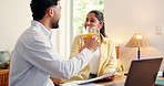 Couple, documents and cheers with juice at house for good news, loan approval and financial freedom. People, laptop and toast drink with paperwork, finance success and celebration for saving increase