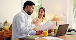 Couple, laptop and discussion with paperwork in home for financial planning, expenses or bills. Man, woman or finance with computer, documents or invoices for mortgage, report or investment in house