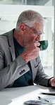 Coffee, happy and businessman in office in morning with finance project for budget planning. Cappuccino, smile and mature male financial manager drinking warm beverage with laptop for investment.