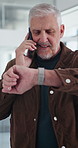 Phone call, watch and mature businessman in office for finance negotiation with client. Contact, time management and male financial manager on mobile discussion for investment proposal in workplace.