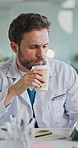 Doctor, coffee and man with tablet in clinic for medical case review, treatment plan or telehealth app. Healthcare, professional and digital tech with beverage for surgery schedule and health update