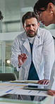 Doctor, team and meeting with records in clinic to review test results, health update or feedback. Healthcare, people and folder in hospital for surgery discussion, medical treatment or brainstorming